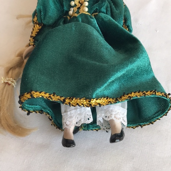 Vintage 8” porcelain doll with green dress on display stand - Picture 7 of 7